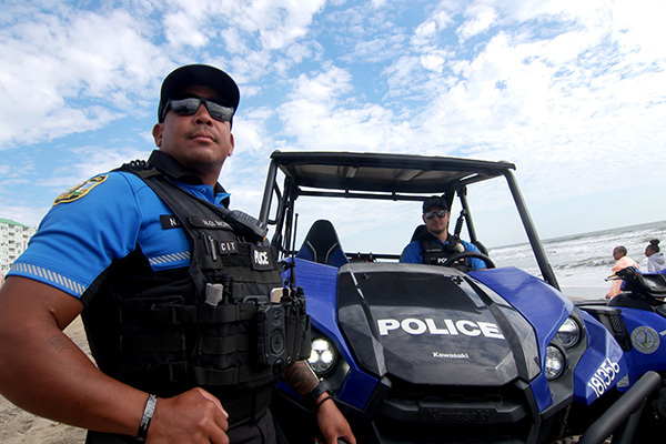 Police officer in front of ATV