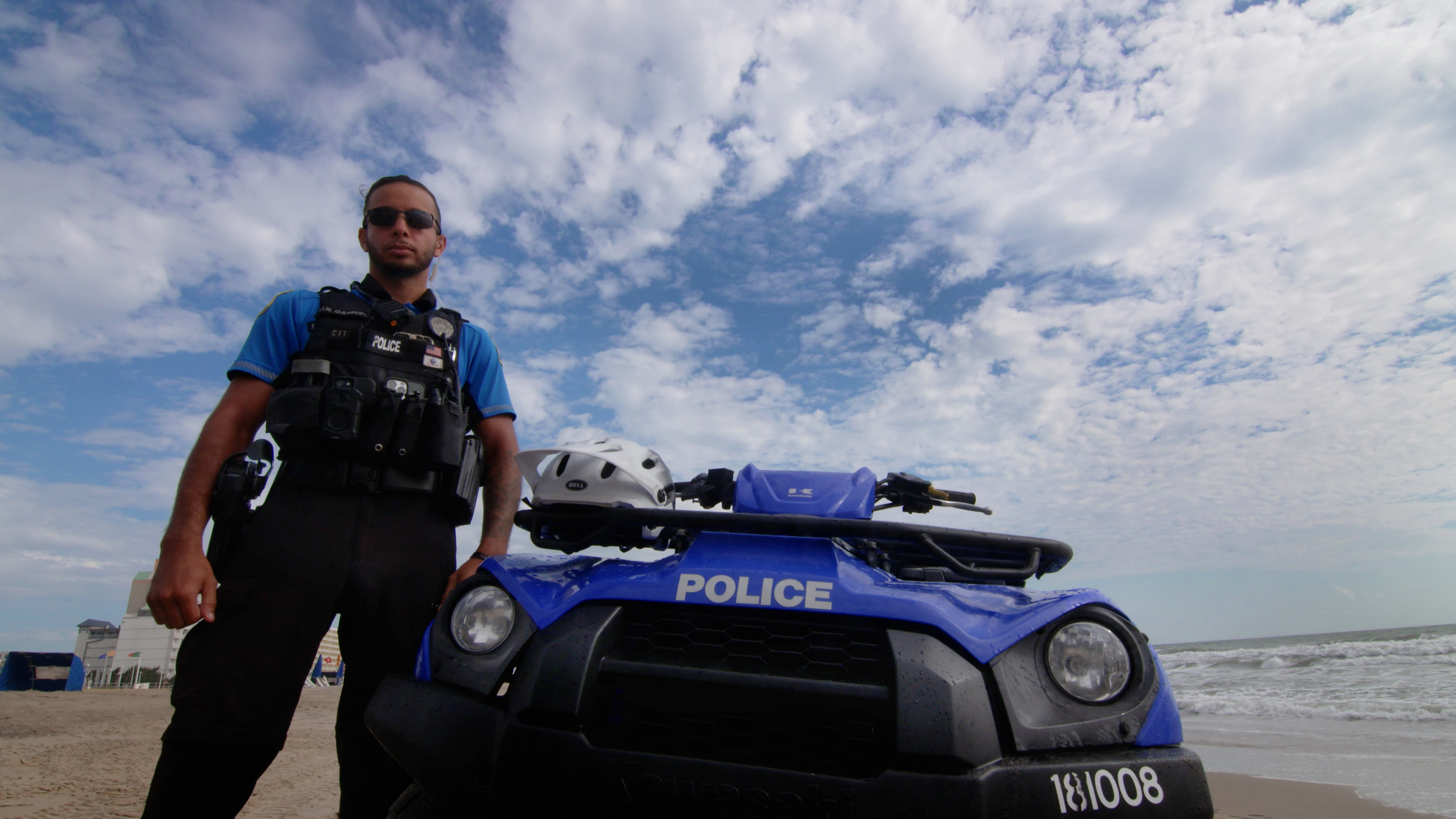 Police Officer next to ATV