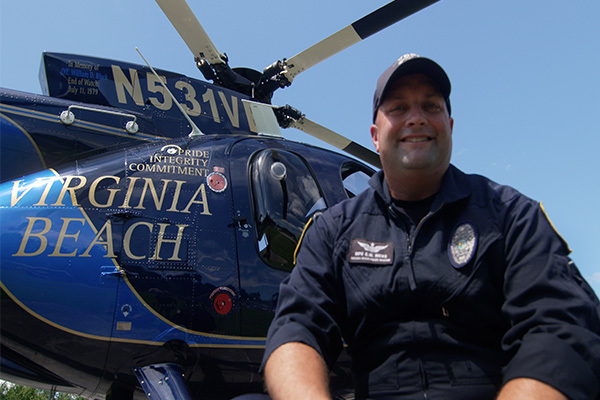 Police officer in front of Helicopter